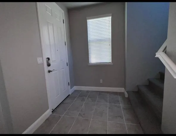 a view of a room with a hardwood