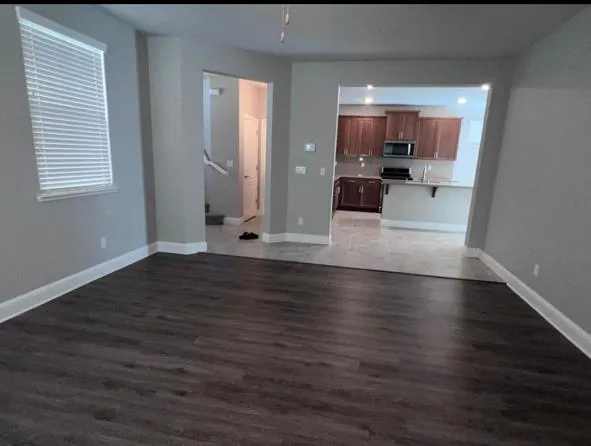 a view of a living room with hardwood floor