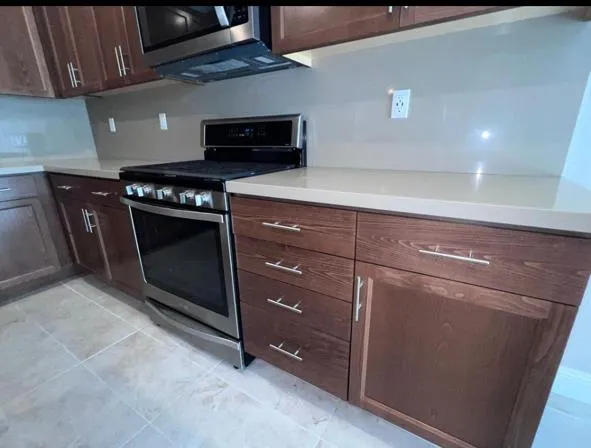 a kitchen with a stove and a microwave