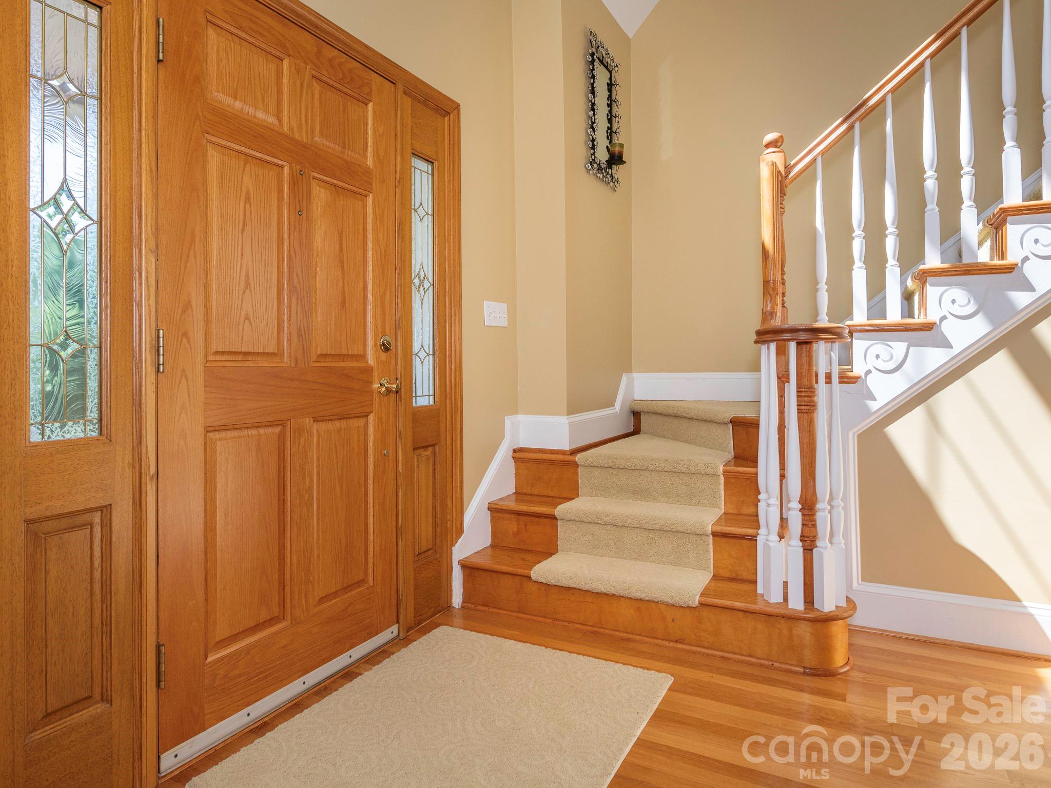 4440 Hucks Road Charlotte, NC 28269 - Photo 3 of 45 a view of entryway with wooden floor and door