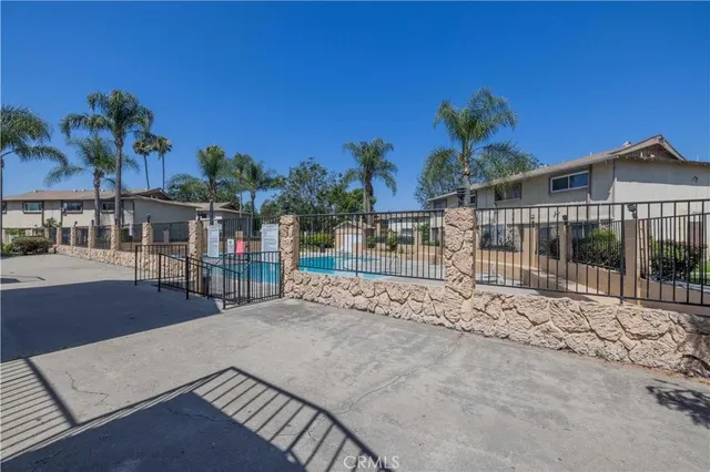 a view of a swimming pool with a patio