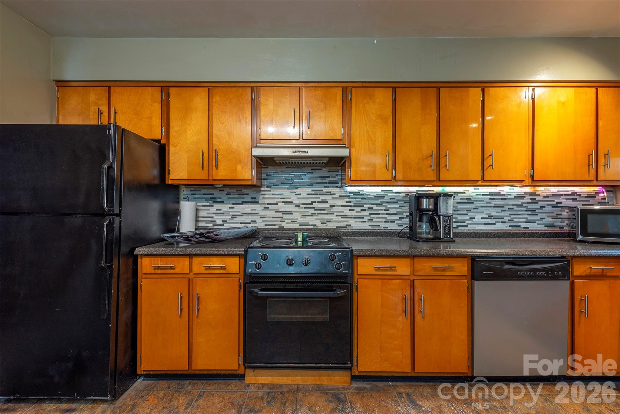 4 Stockwood Road Asheville, NC 28803 - Photo 16 of 41 a kitchen with stainless steel appliances granite countertop furniture a refrigerator and a sink
