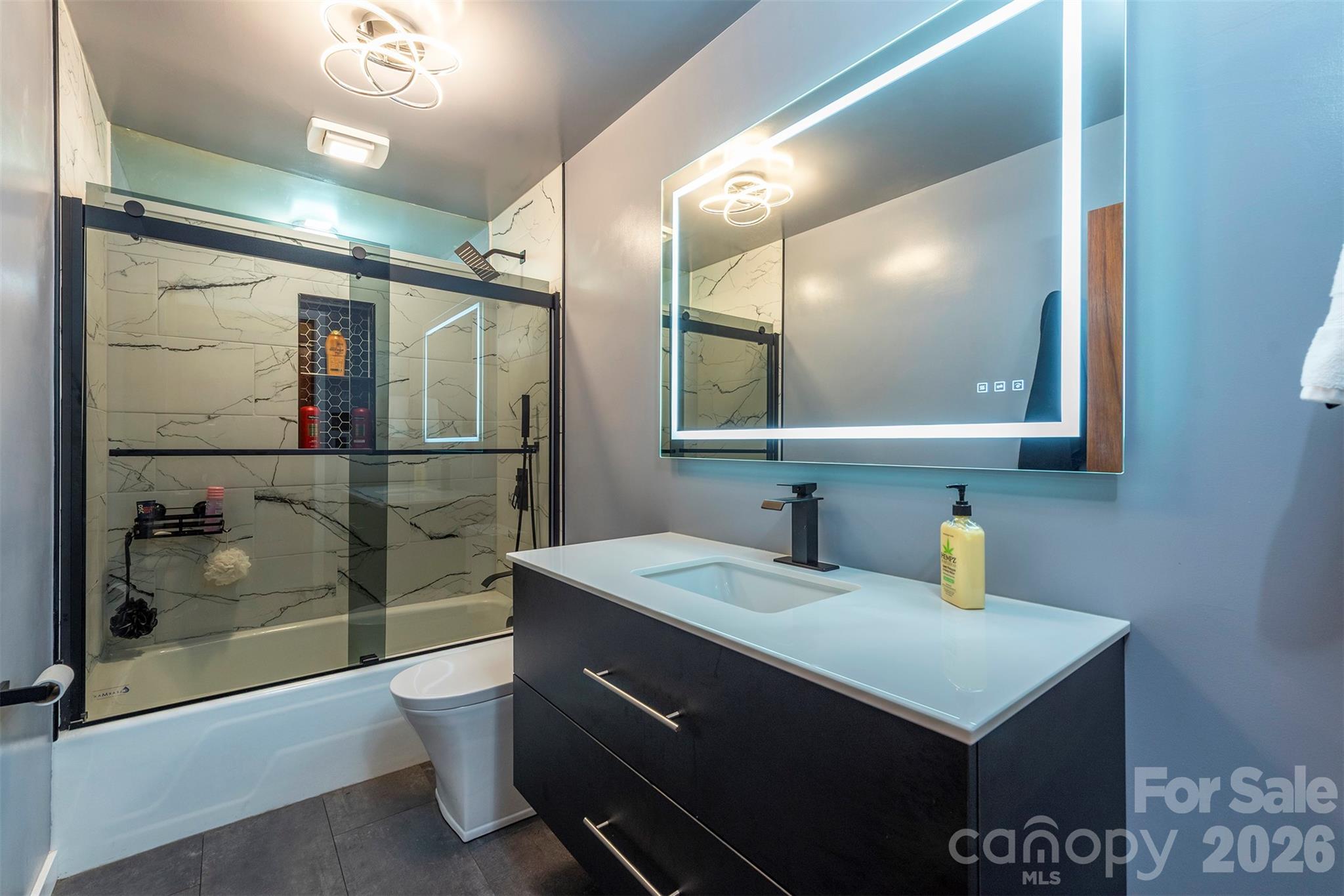 4 Stockwood Road Asheville, NC 28803 - Photo 19 of 41 a bathroom with a sink and a mirror