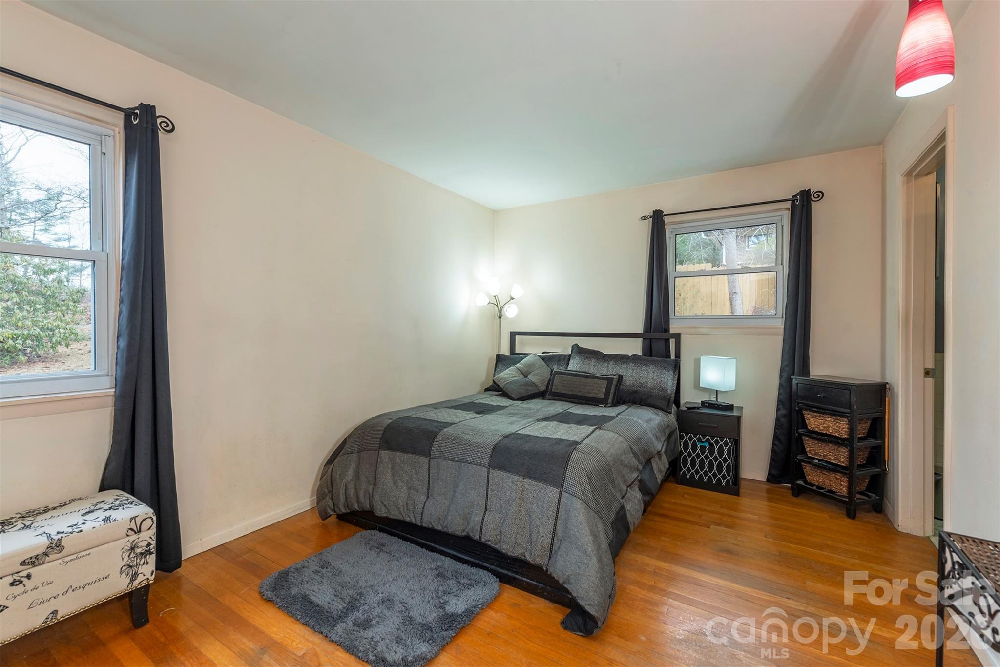 4 Stockwood Road Asheville, NC 28803 - Photo 20 of 41 a bedroom with a bed and window