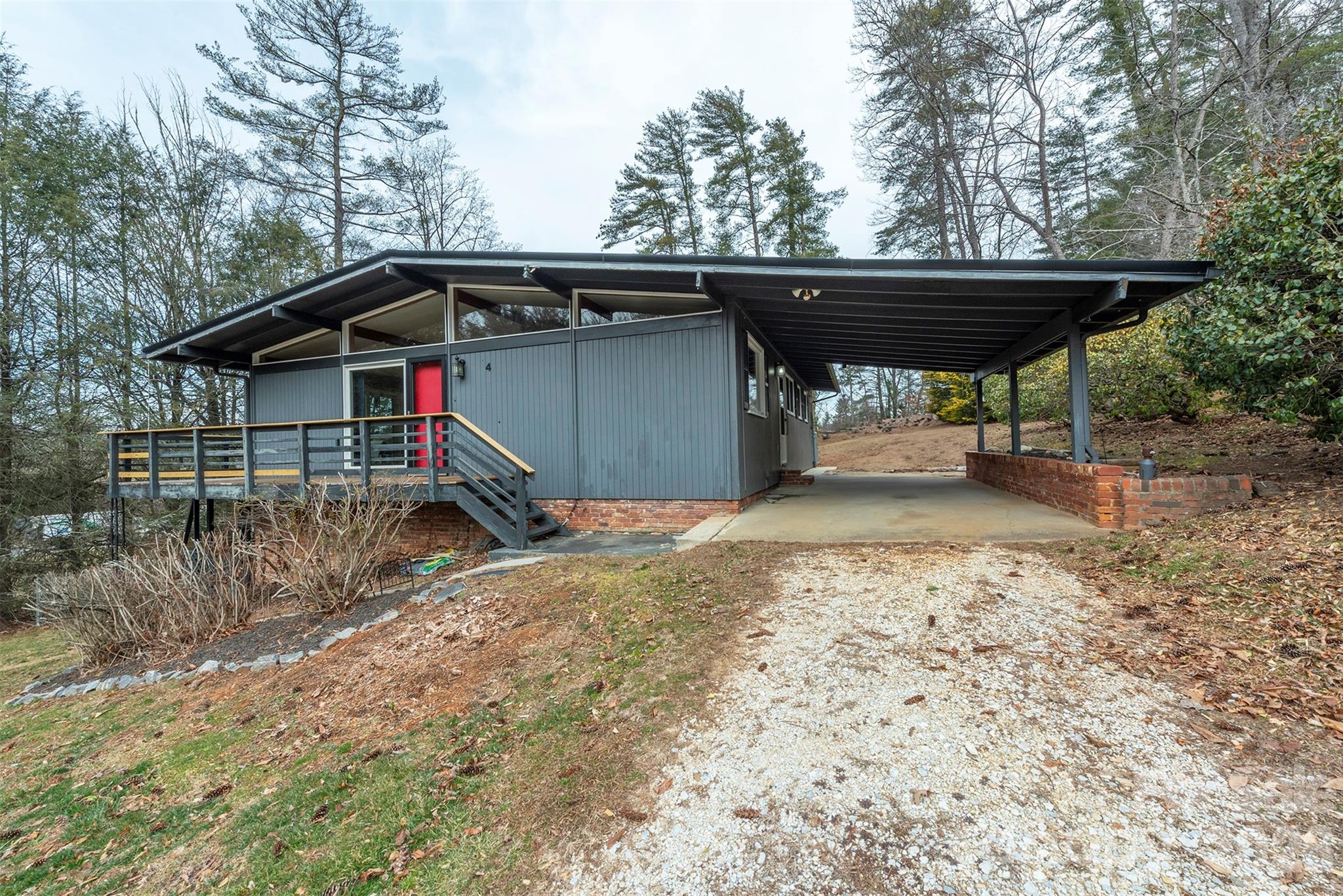 4 Stockwood Road Asheville, NC 28803 - Photo 2 of 41 a view of backyard with wooden fence and a large tree