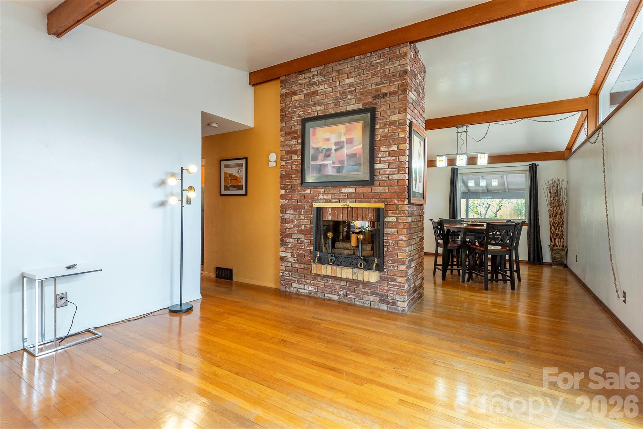 4 Stockwood Road Asheville, NC 28803 - Photo 5 of 41 a view of a livingroom with a fireplace and dining room
