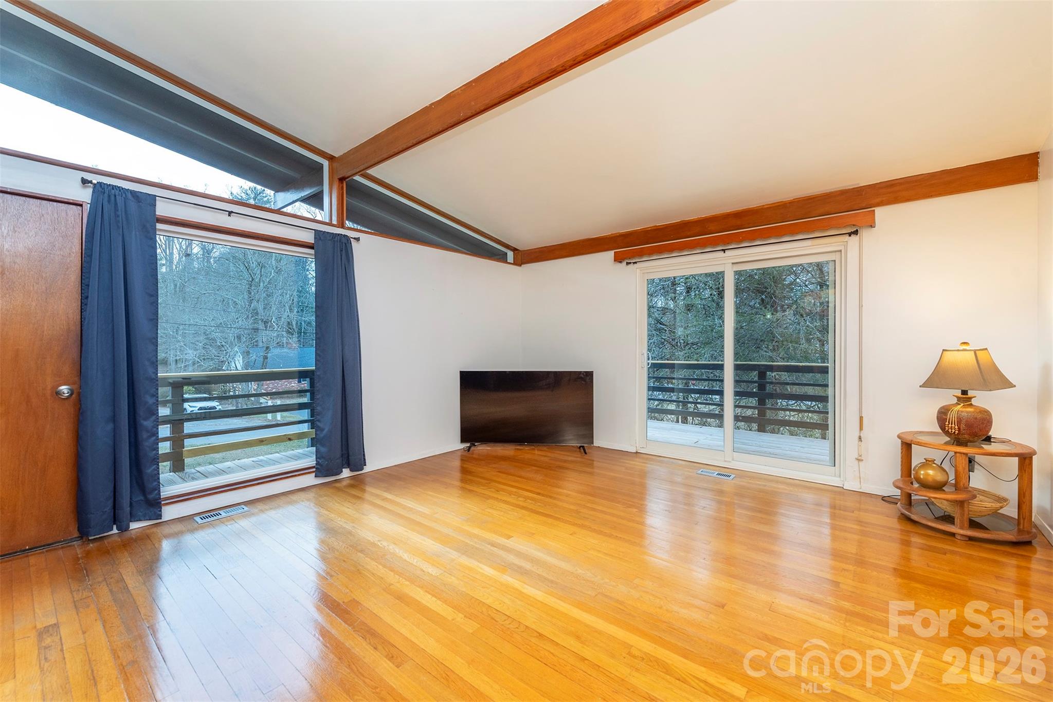 4 Stockwood Road Asheville, NC 28803 - Photo 8 of 41 a view of a room with wooden floor and windows