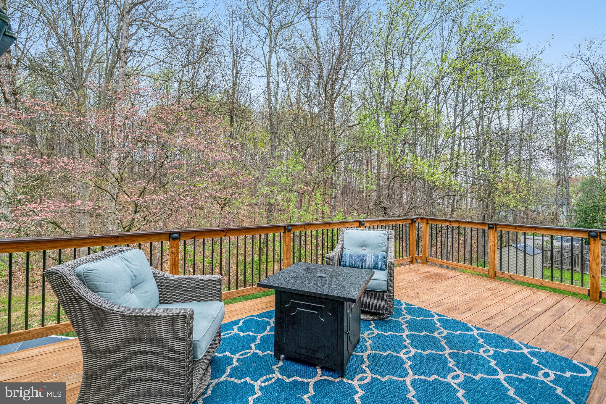 7924 Forest Path Way Springfield, VA 22153 - Photo 16 of 42 a balcony with wooden floor and outdoor seating