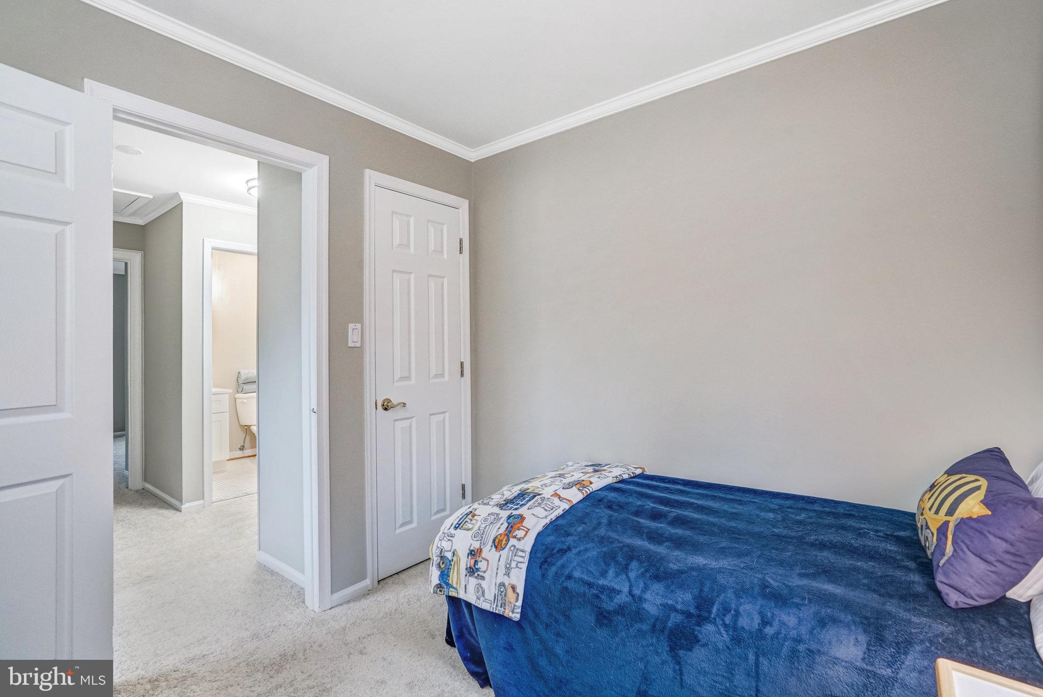7924 Forest Path Way Springfield, VA 22153 - Photo 29 of 42 a bedroom with a bed and a window