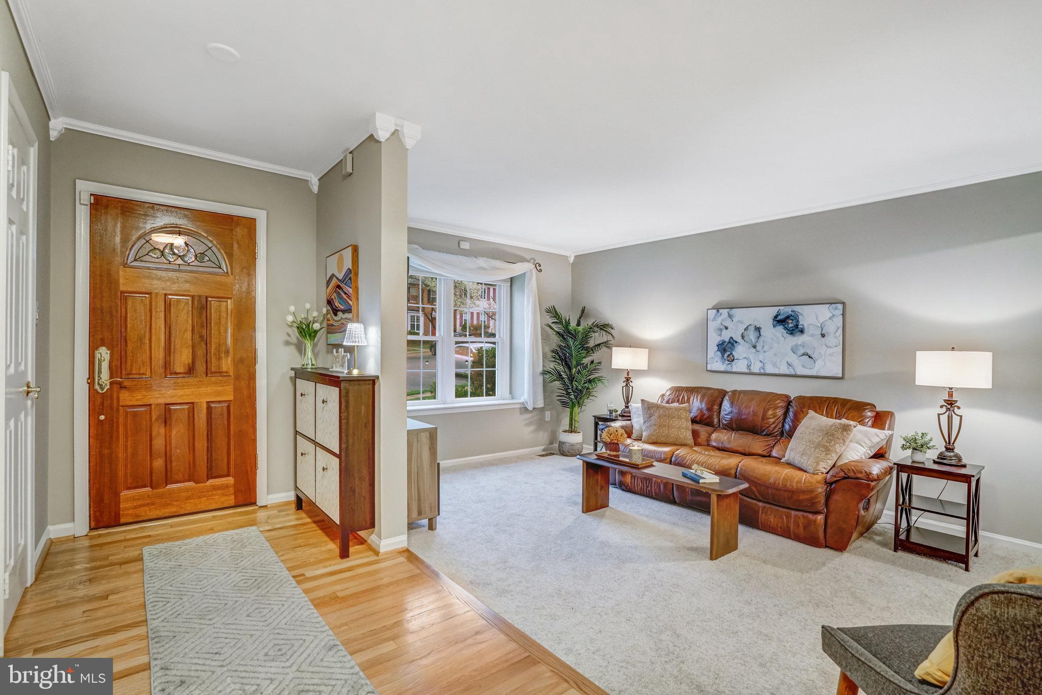7924 Forest Path Way Springfield, VA 22153 - Photo 3 of 42 a living room with furniture and a rug