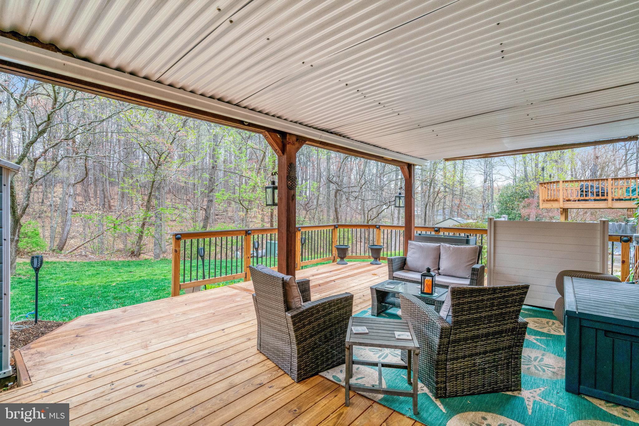 7924 Forest Path Way Springfield, VA 22153 - Photo 35 of 42 a living room with furniture and a floor to ceiling window