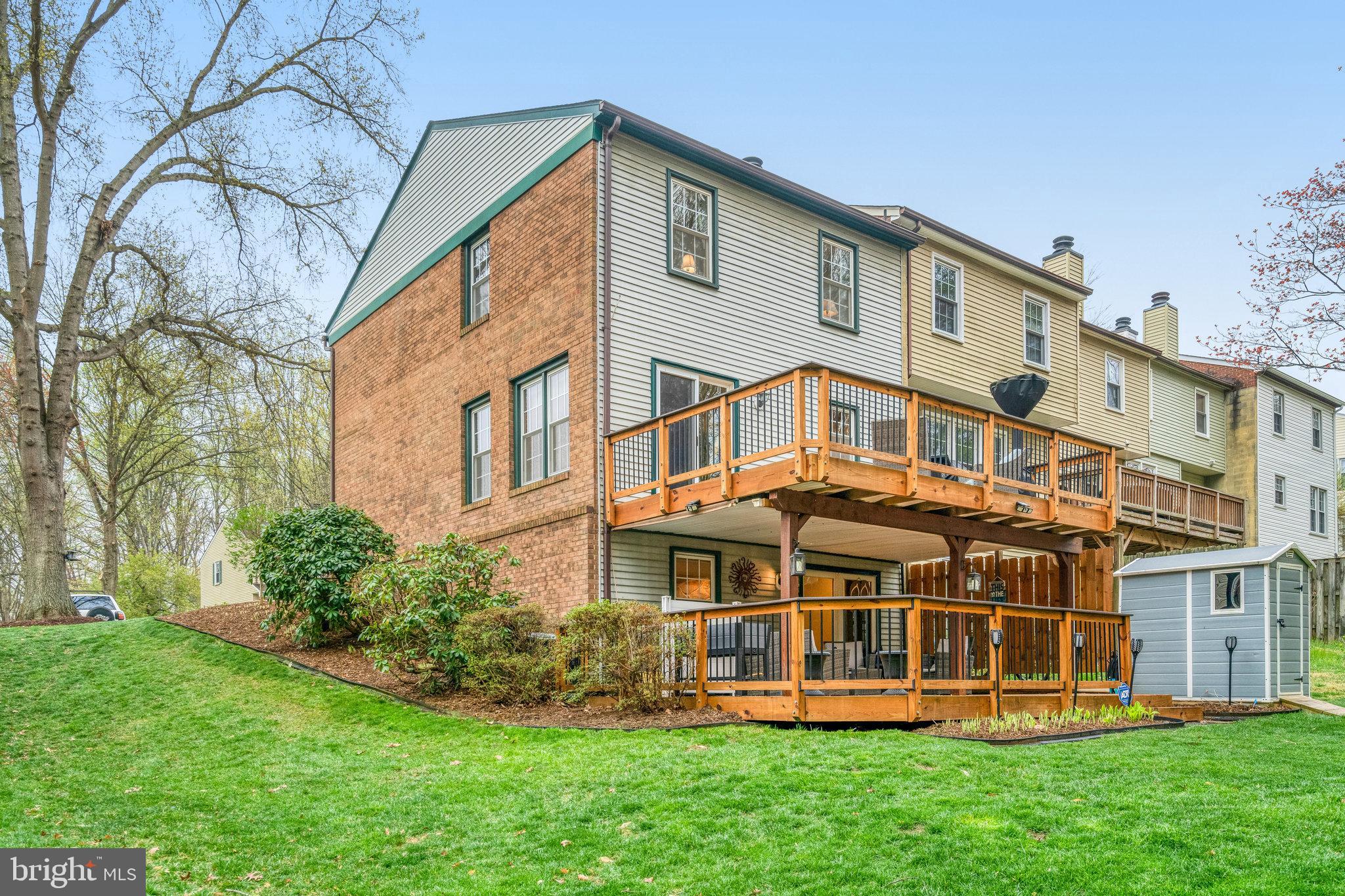 7924 Forest Path Way Springfield, VA 22153 - Photo 38 of 42 a front view of a house with a yard and trees
