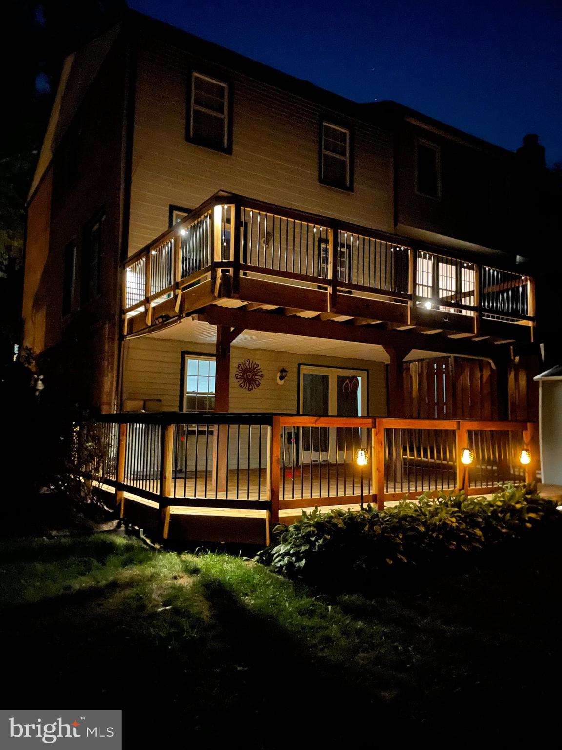 7924 Forest Path Way Springfield, VA 22153 - Photo 40 of 42 a front view of a house with a garden