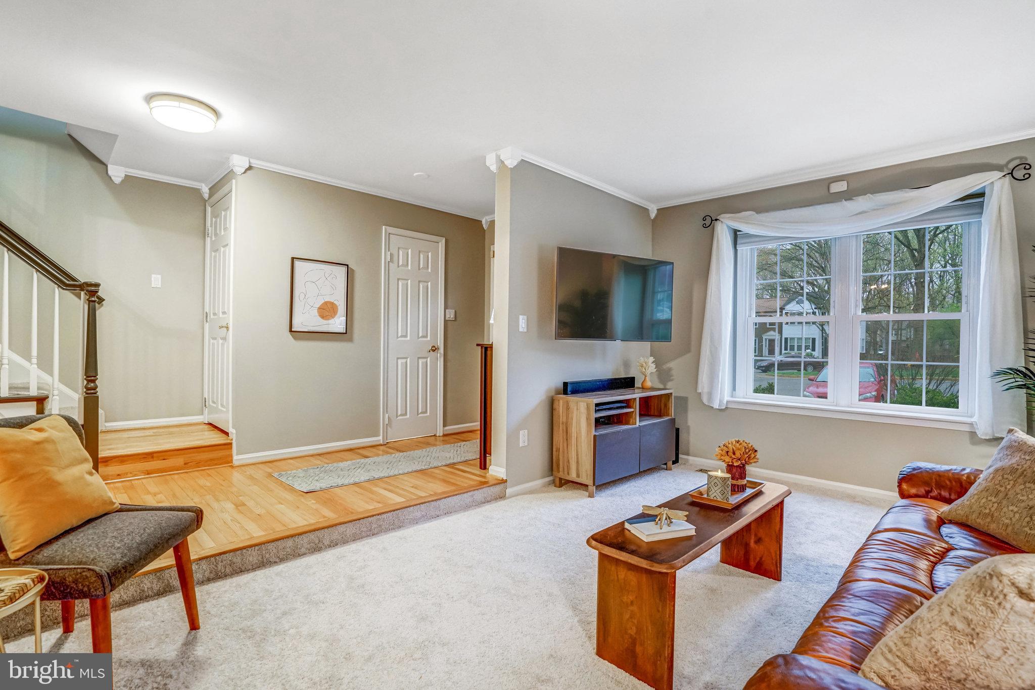 7924 Forest Path Way Springfield, VA 22153 - Photo 4 of 42 a living room with furniture and a flat screen tv