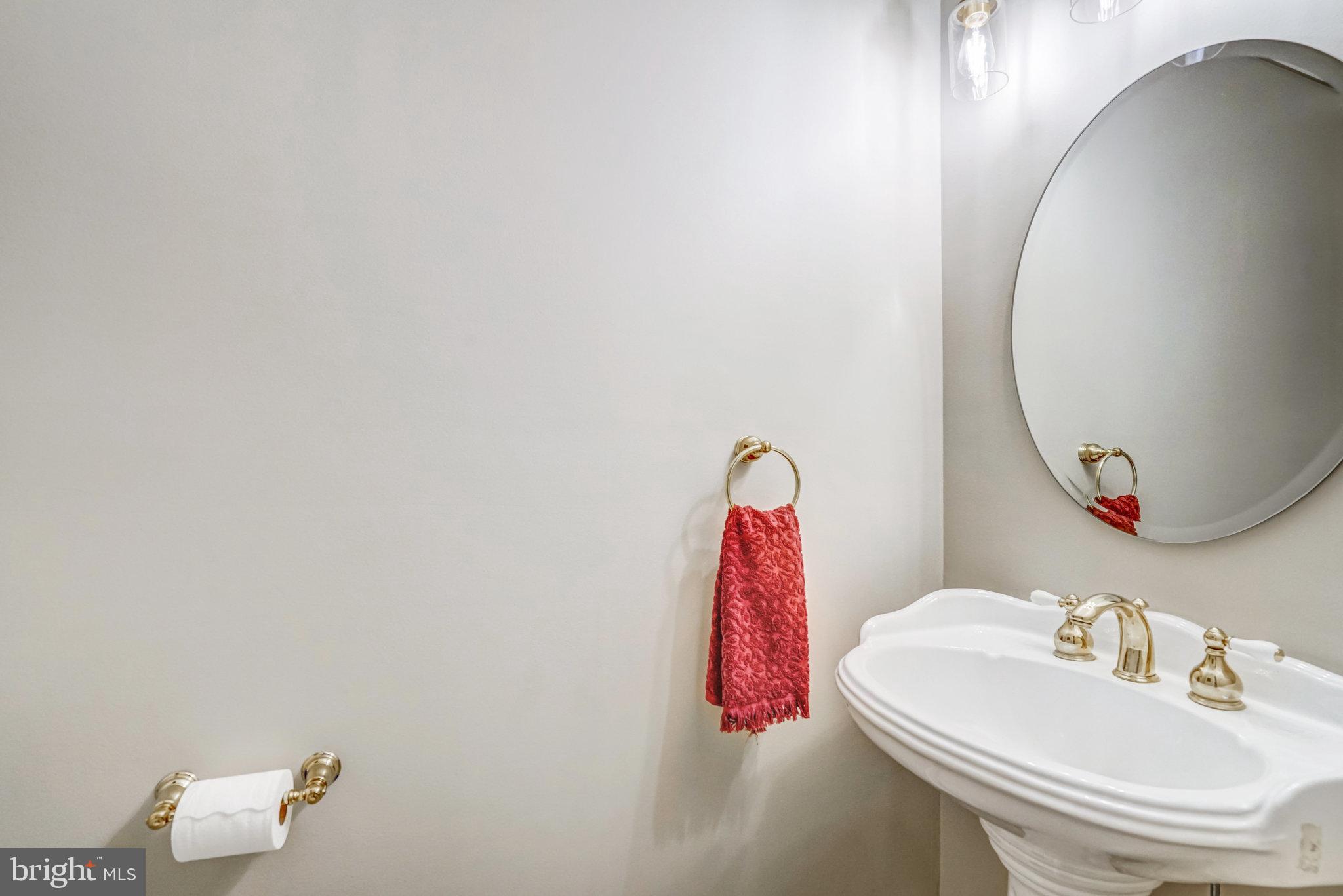 7924 Forest Path Way Springfield, VA 22153 - Photo 5 of 42 a bathroom with a sink and a mirror