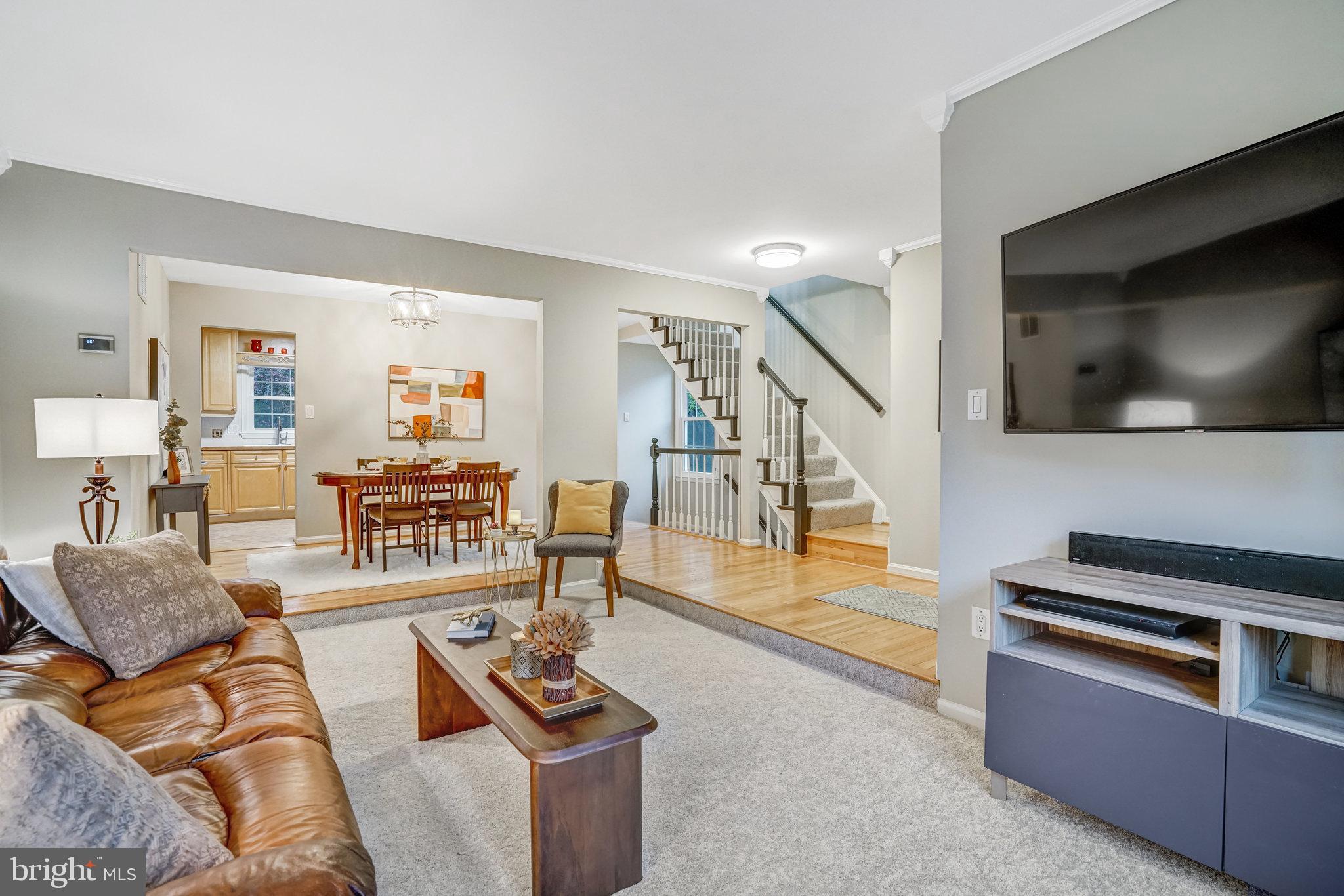 7924 Forest Path Way Springfield, VA 22153 - Photo 6 of 42 a living room with furniture and a flat screen tv
