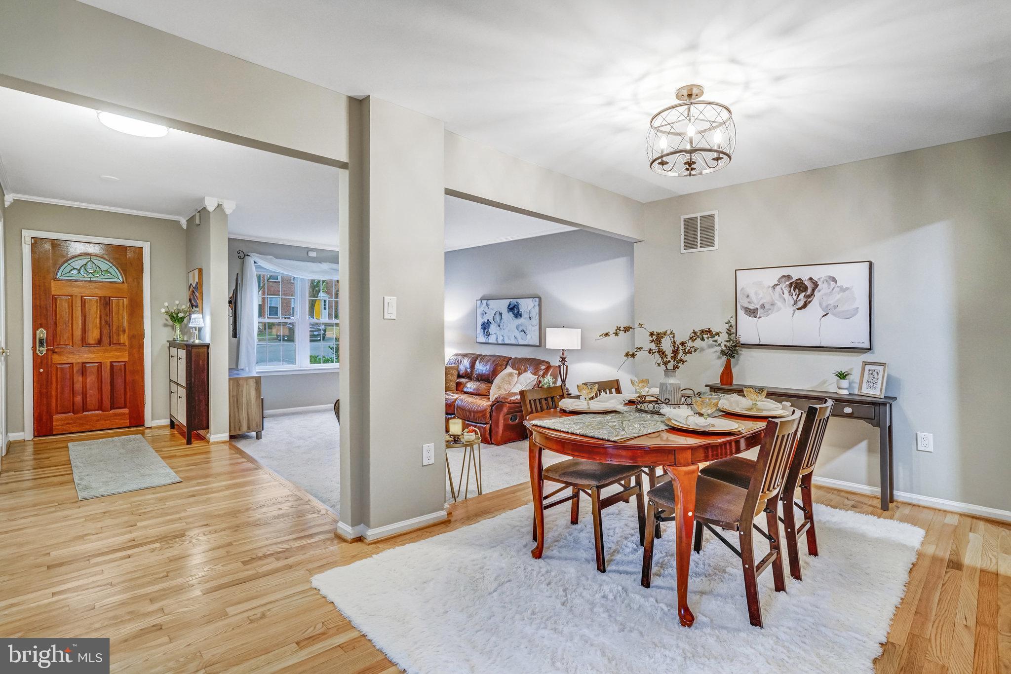 7924 Forest Path Way Springfield, VA 22153 - Photo 8 of 42 a view of a dining room with furniture
