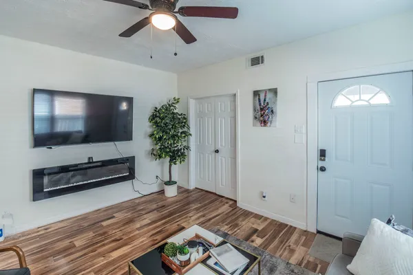 a bedroom with a bed and a flat screen tv