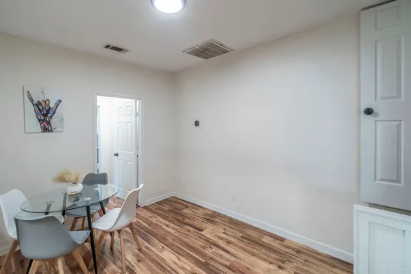 a view of a room that has a table and chair in it