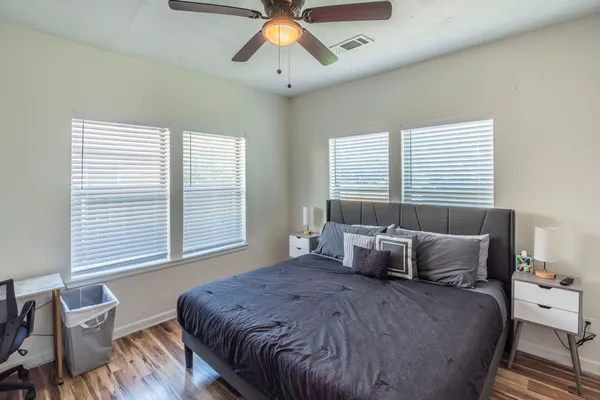 a bedroom with a bed and window