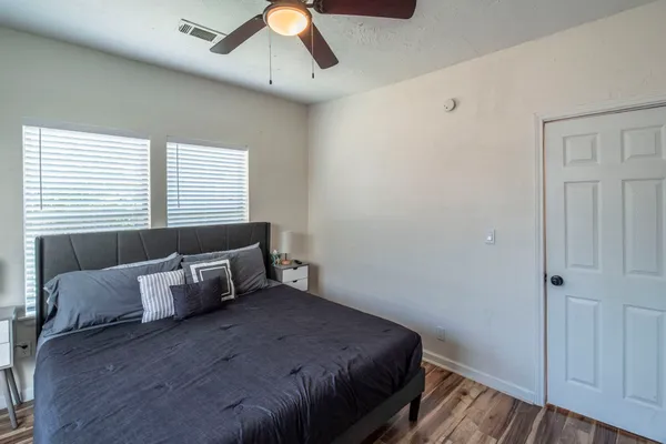 a bedroom with bed and window