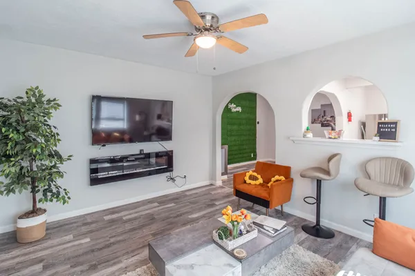 a living room with furniture and a flat screen tv