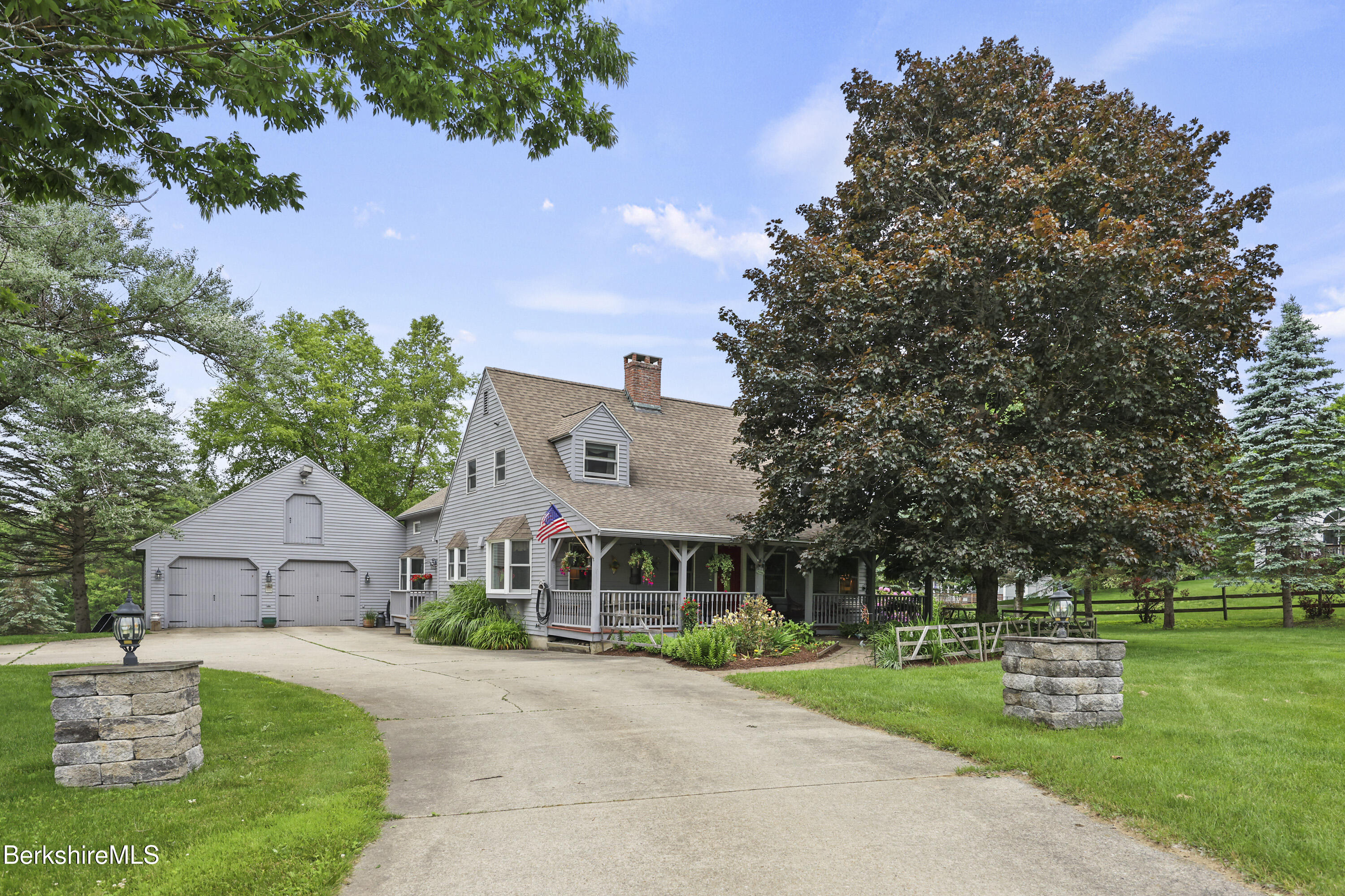 135 East Street Lee, MA 01238 - Photo 2 of 49 a front view of house with yard and green space