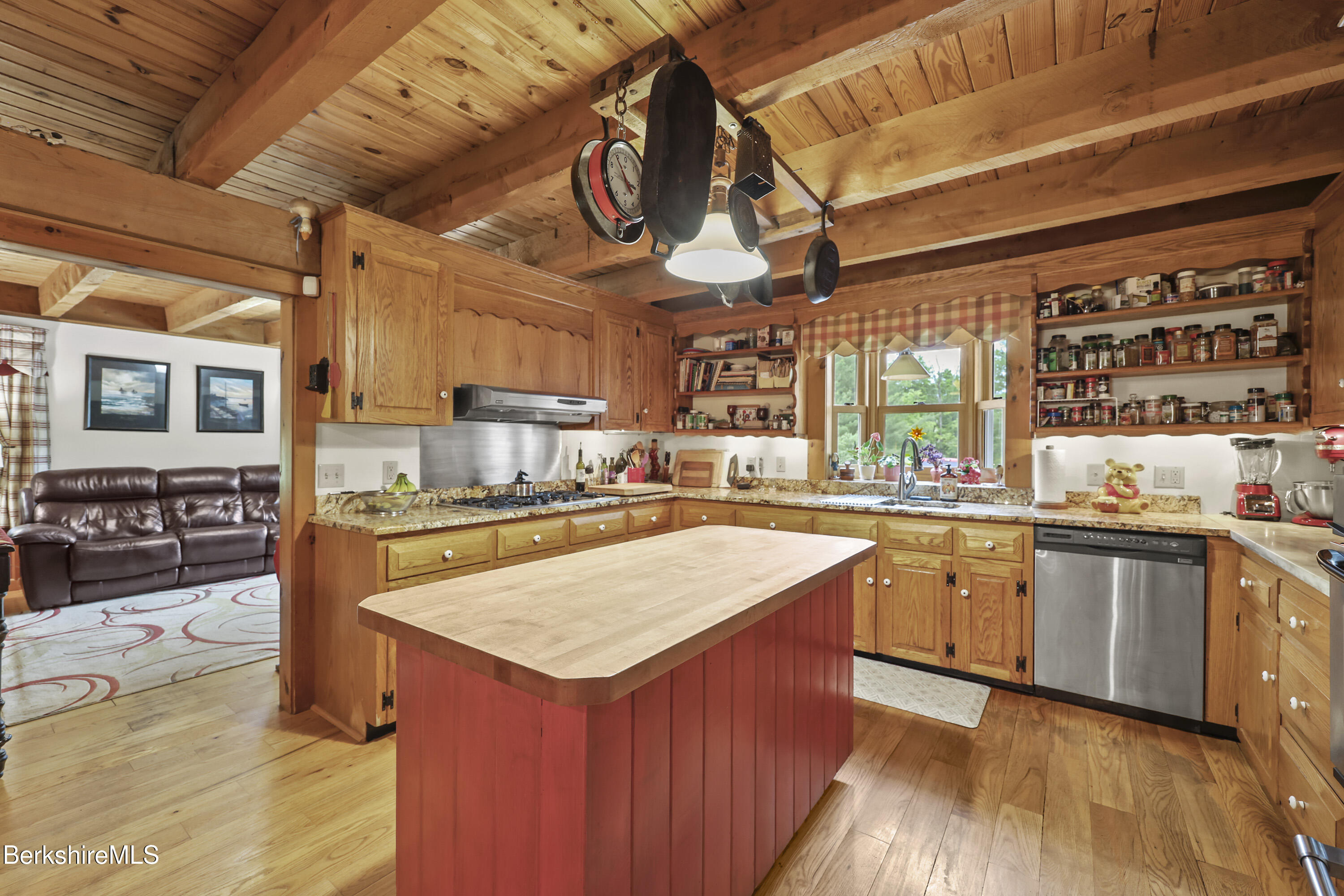 135 East Street Lee, MA 01238 - Photo 23 of 49 a kitchen with stainless steel appliances granite countertop a sink a stove and a wooden floors