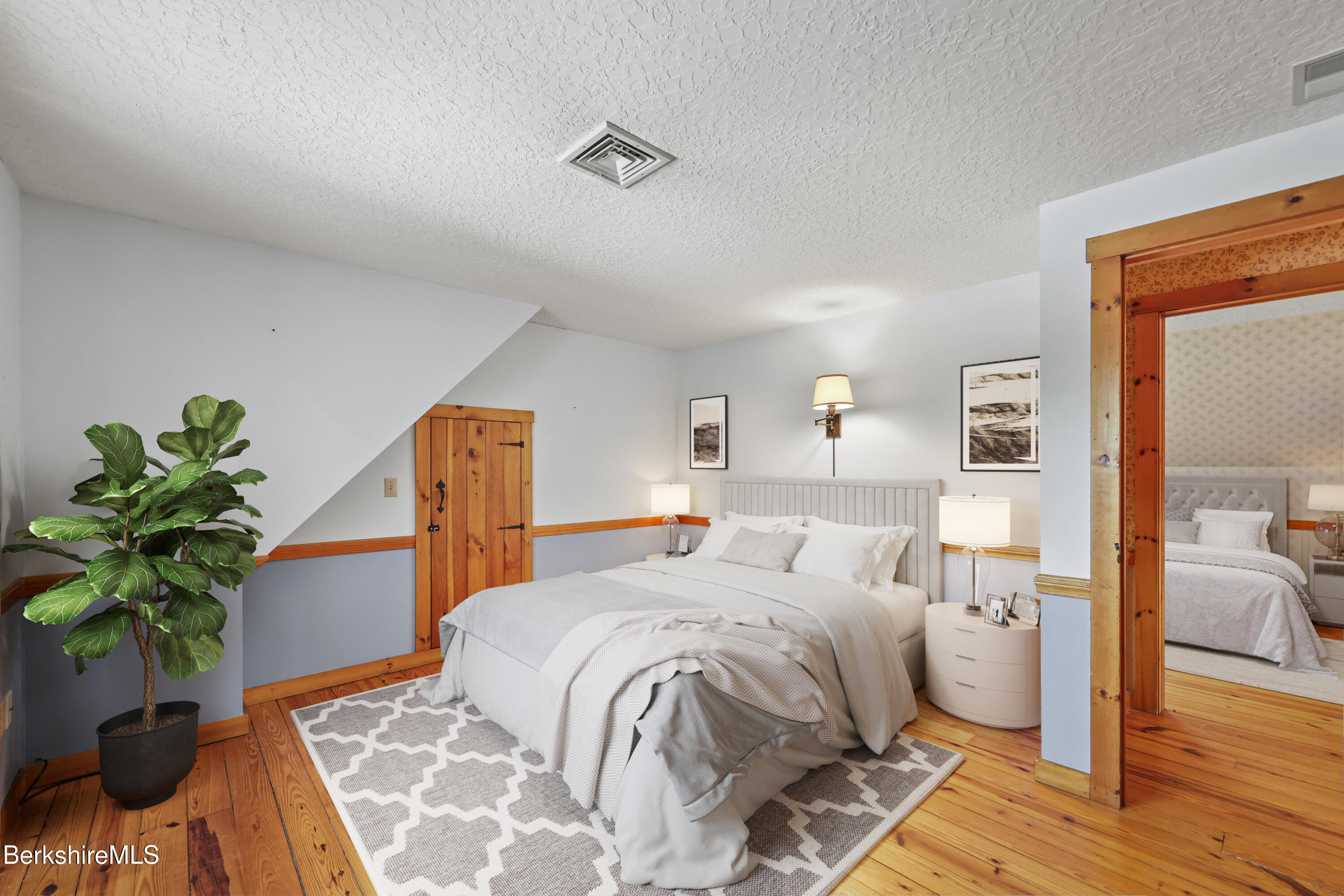 135 East Street Lee, MA 01238 - Photo 30 of 49 a bedroom with a bed and a potted plant