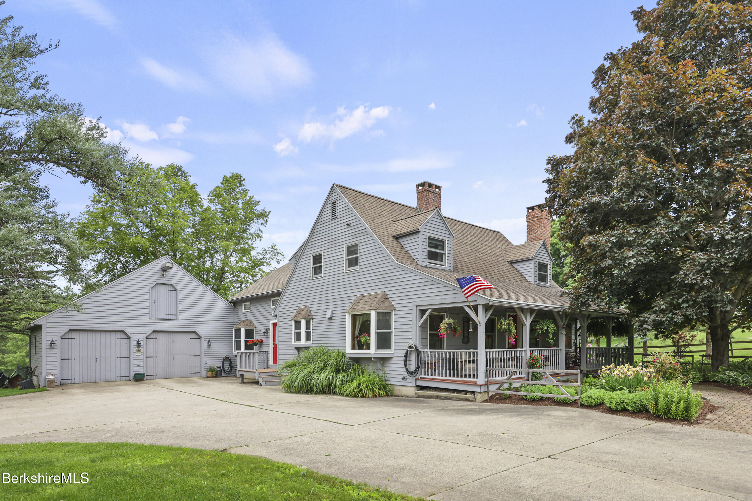 135 East Street Lee, MA 01238 - Photo 4 of 49 a front view of a house with a garden