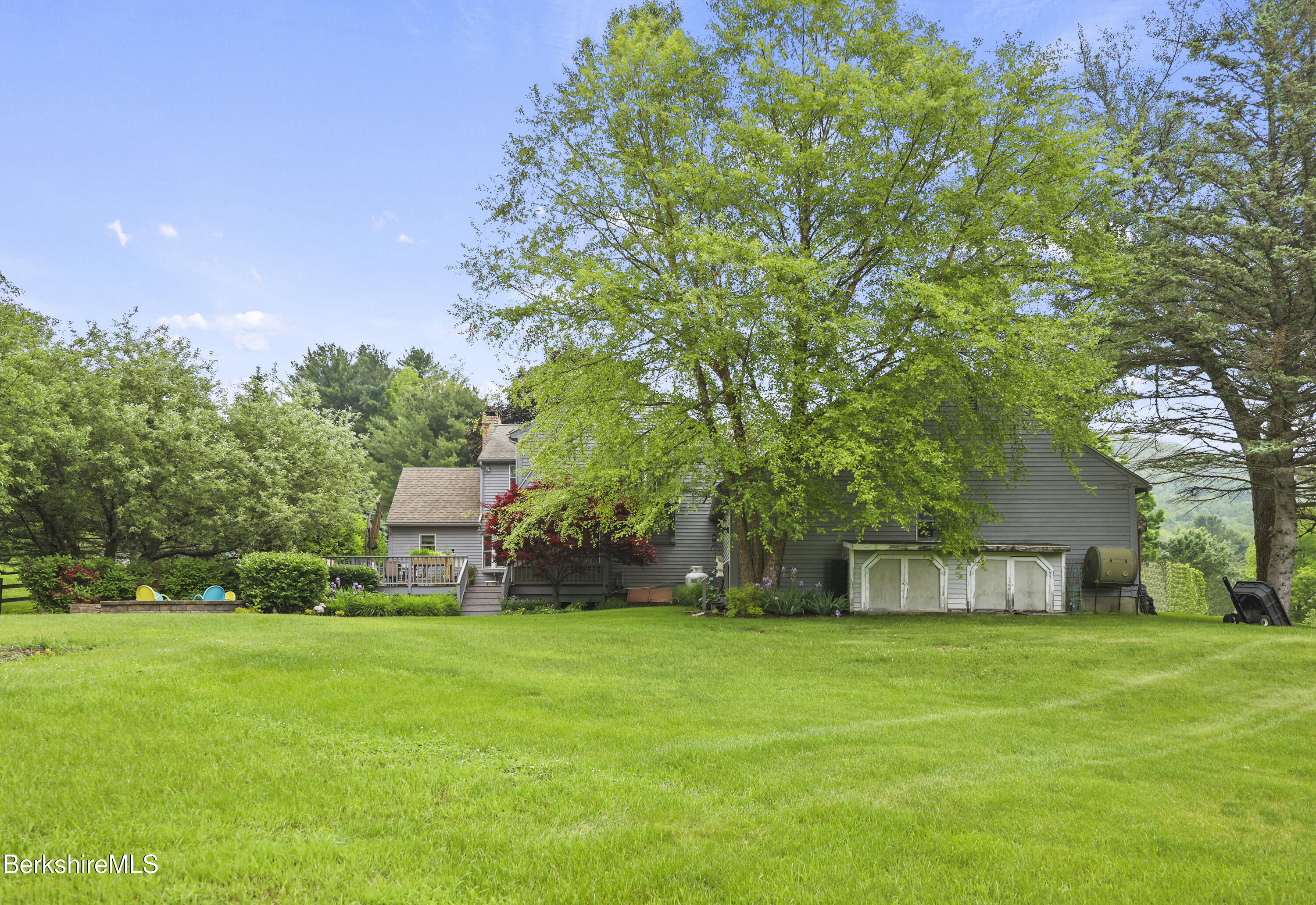 135 East Street Lee, MA 01238 - Photo 43 of 49 a view of a house with a backyard