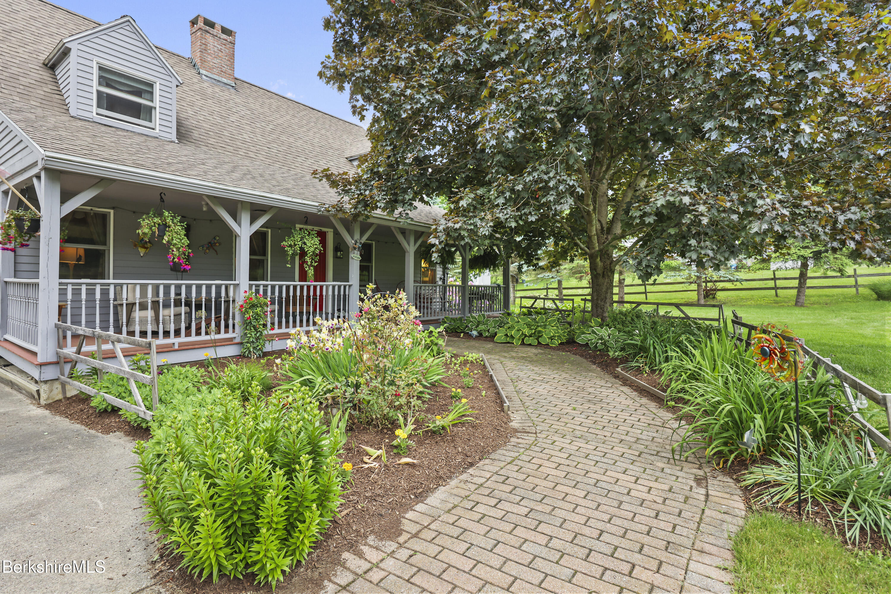 135 East Street Lee, MA 01238 - Photo 7 of 49 a front view of a house with garden