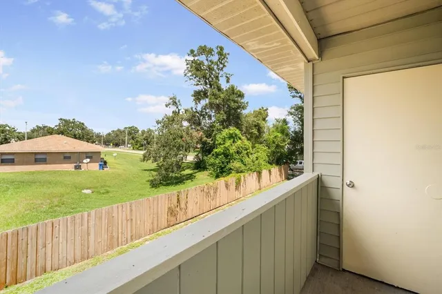 a view of a garden from a balcony