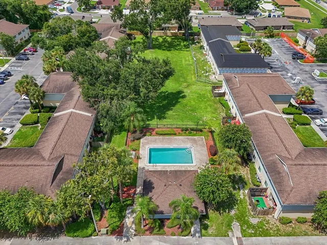 an aerial view of house with yard