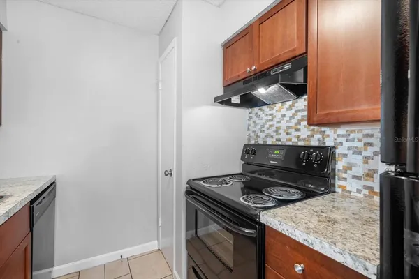 a kitchen with a stove and a microwave
