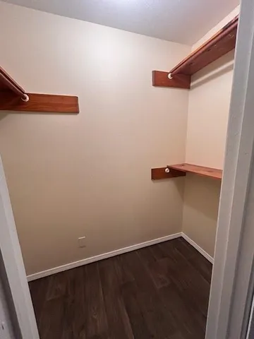 a bathroom with a granite countertop sink a toilet and bathtub