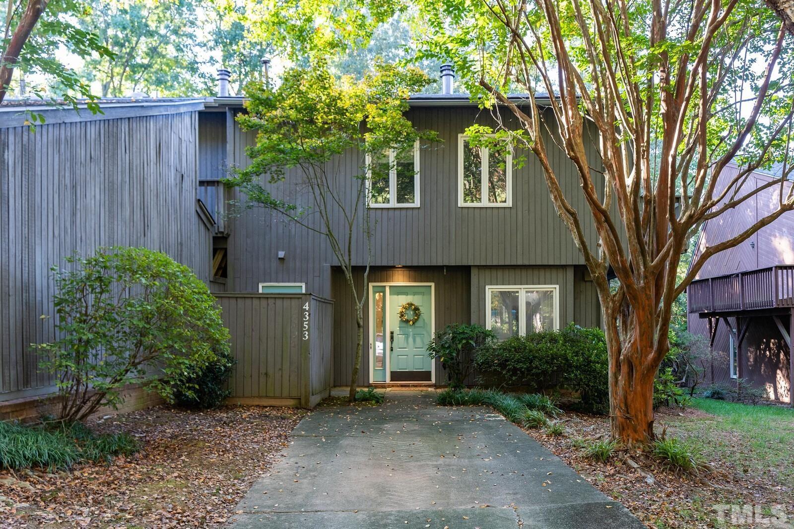 4353 Sunscape Lane Raleigh, NC 27613 - Photo 1 of 30 a front view of a house with garden