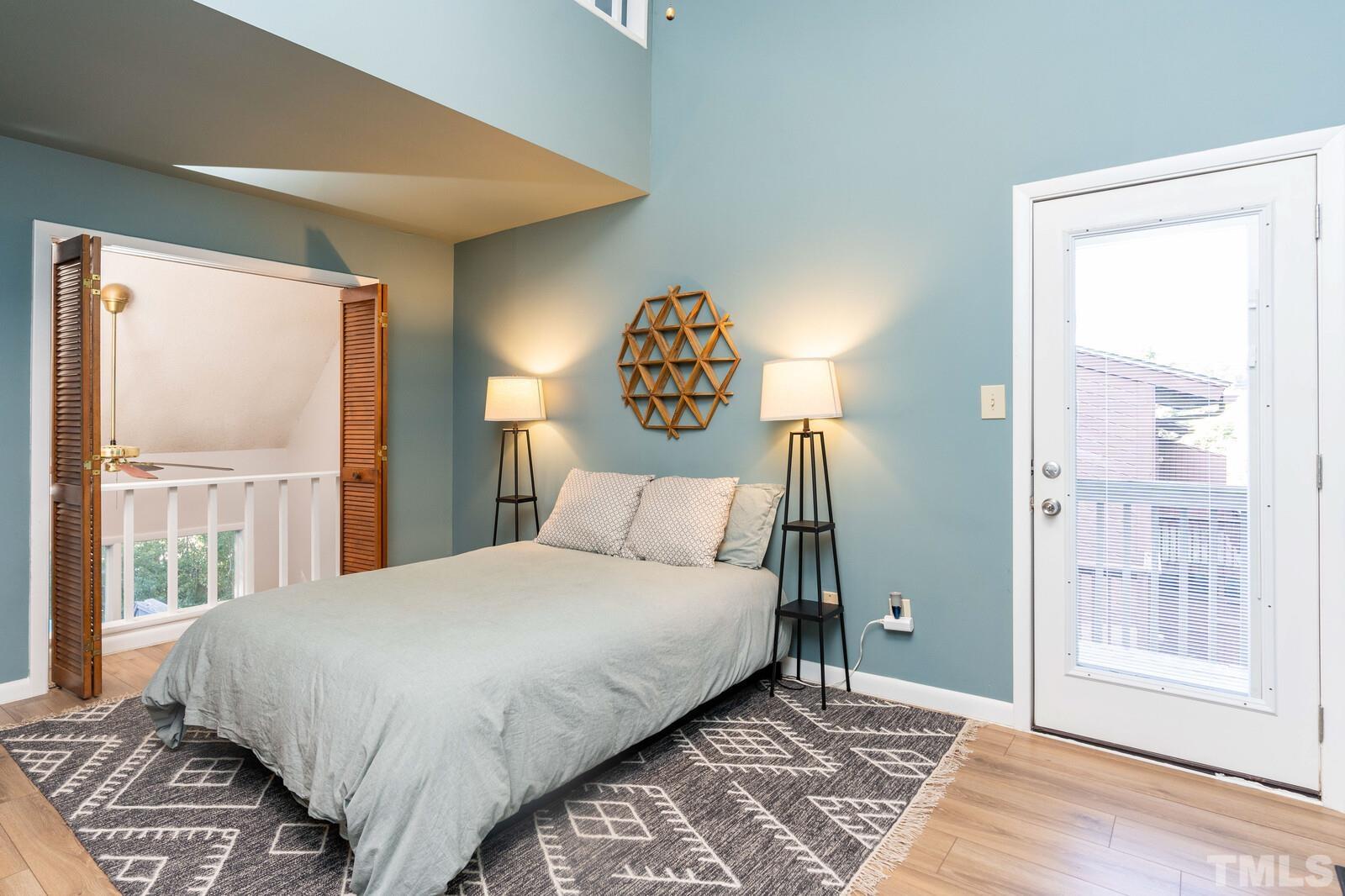 4353 Sunscape Lane Raleigh, NC 27613 - Photo 16 of 30 a bedroom with a large bed and a window