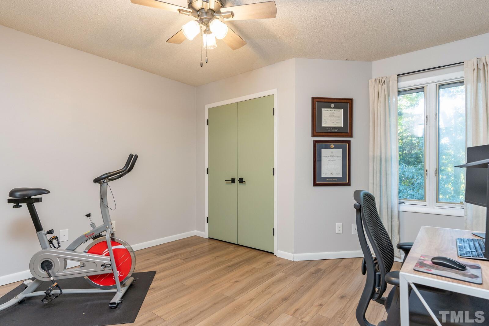 4353 Sunscape Lane Raleigh, NC 27613 - Photo 24 of 30 a view of a workspace with furniture and a window