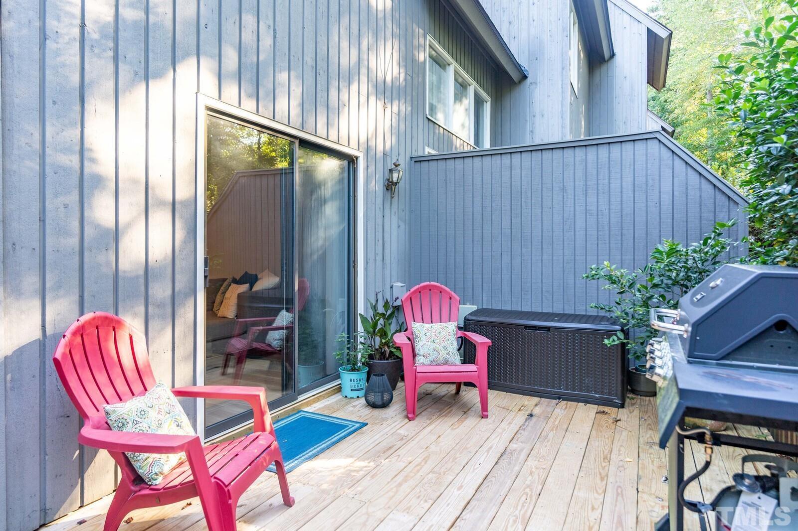 4353 Sunscape Lane Raleigh, NC 27613 - Photo 26 of 30 a backyard of a house with table and chairs