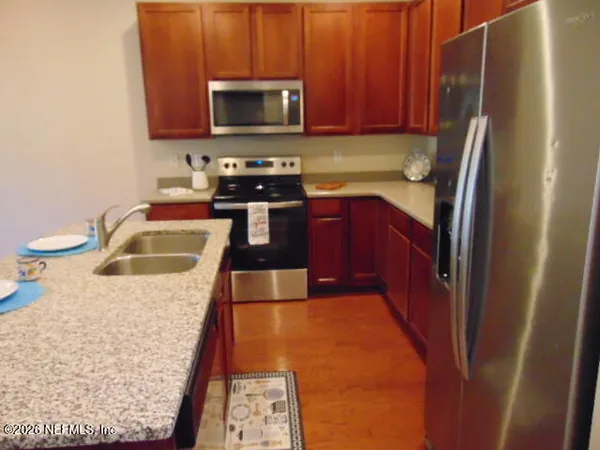 a kitchen with sink and window