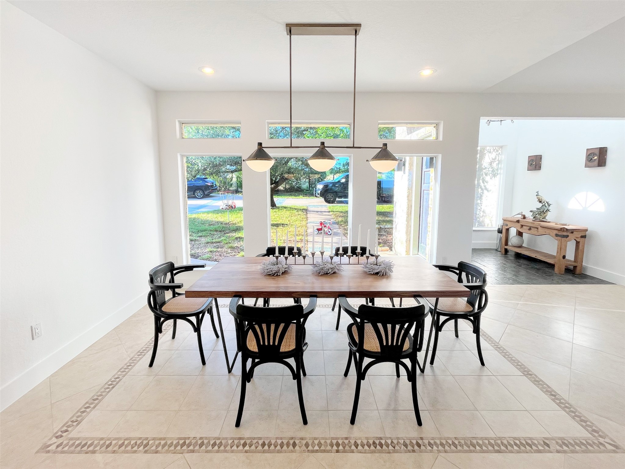 1015 Westland Ridge Road Dripping Springs, TX 78620 - Photo 9 of 32 Natural light streams into this generously proportioned dining space, ideal for entertaining.