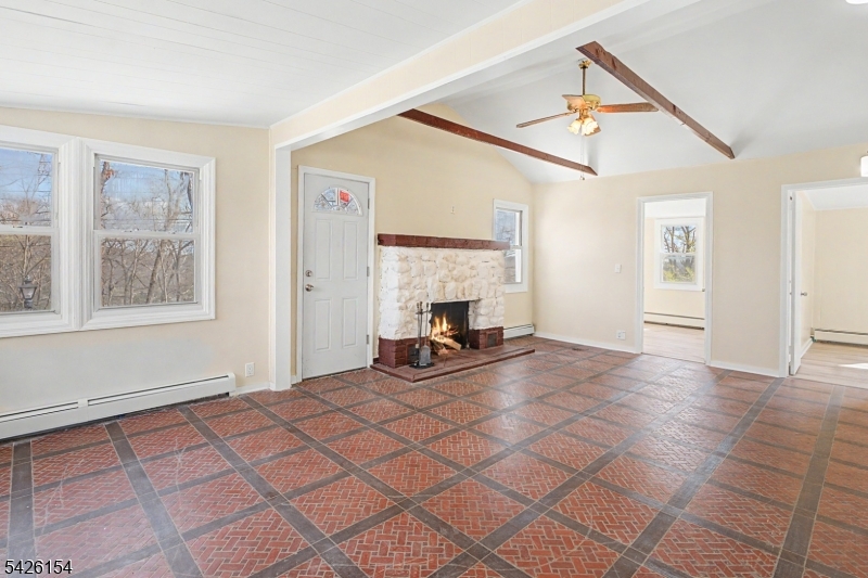 10 Berton Road Boonton, NJ 07005 - Photo 6 of 20 a view of empty room with fireplace and windows
