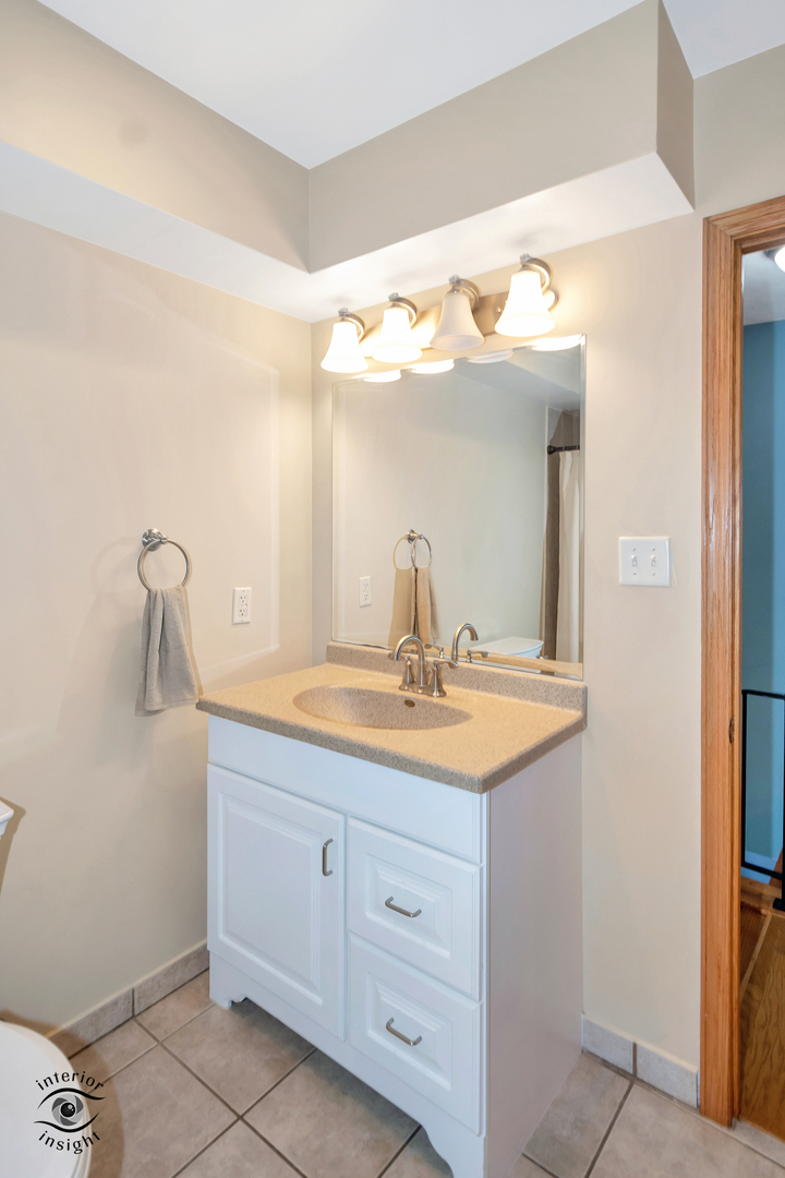 24158 Marble Road Channahon, IL 60410 - Photo 17 of 26 a bathroom with a granite countertop sink and a mirror