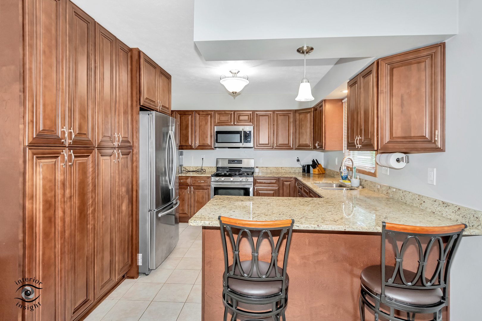 24158 Marble Road Channahon, IL 60410 - Photo 7 of 26 a kitchen with a refrigerator a stove a sink and a cabinets