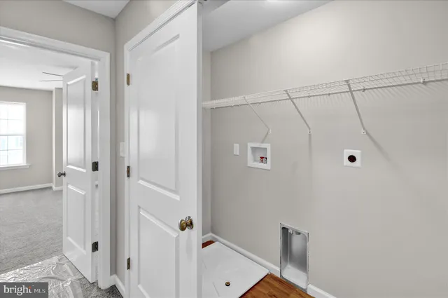a bathroom with a shower sink vanity mirror and toilet