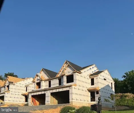 a view of a white building among the street