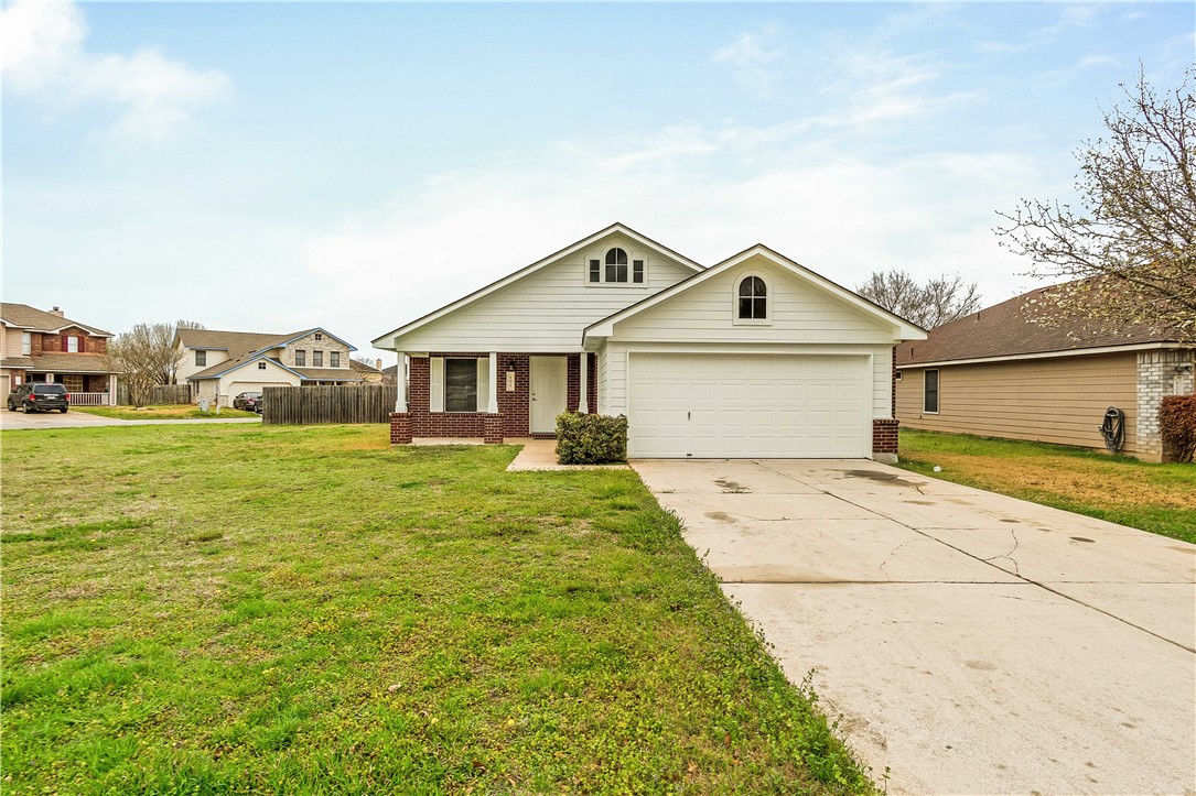 101 Madisons Way Buda, TX 78610 - Photo 1 of 1 a front view of a house with garden