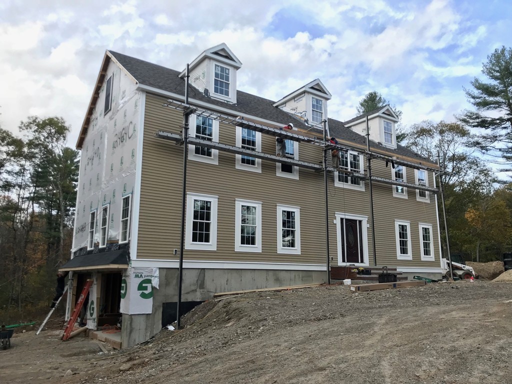 22 Tracywood Road Canton, MA 02021 - Photo 11 of 28 a front view of a house with garage