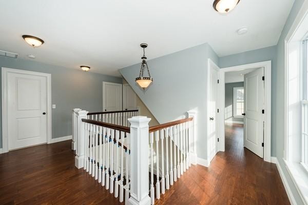 22 Tracywood Road Canton, MA 02021 - Photo 7 of 28 a view of a hallway with wooden floor and stairs